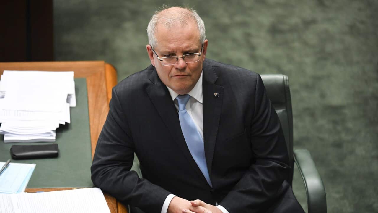 Australian Prime Minister Scott Morrison reacts during House of Representatives Question Time at Parliament House in Canberra, Wednesday, April 8, 2020. (AAP Image/Lukas Coch) NO ARCHIVING