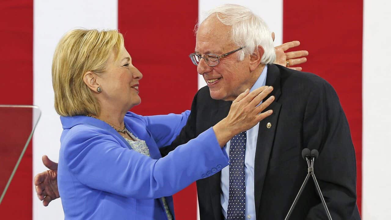 Hillary Clinton and Bernie Sanders appear together at an event in Portsmouth, New Hampshire, 2016.