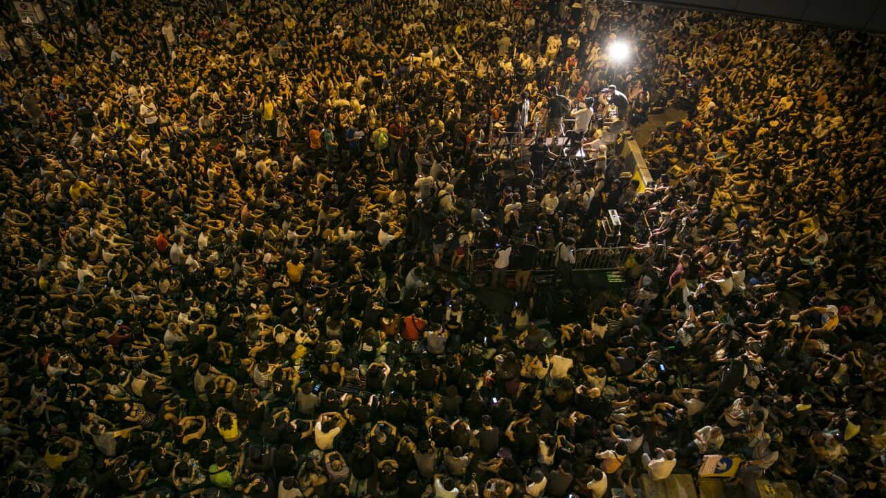 Tens of thousands of democracy protesters listen during speeches October 4, 2014 in Hong Kong.
