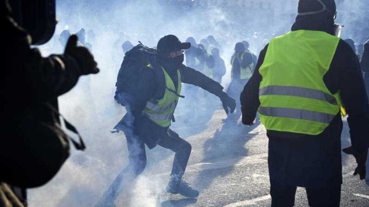Protesters from the 'Gilets Jaunes' movement clash with French riot police in Paris on Saturday.