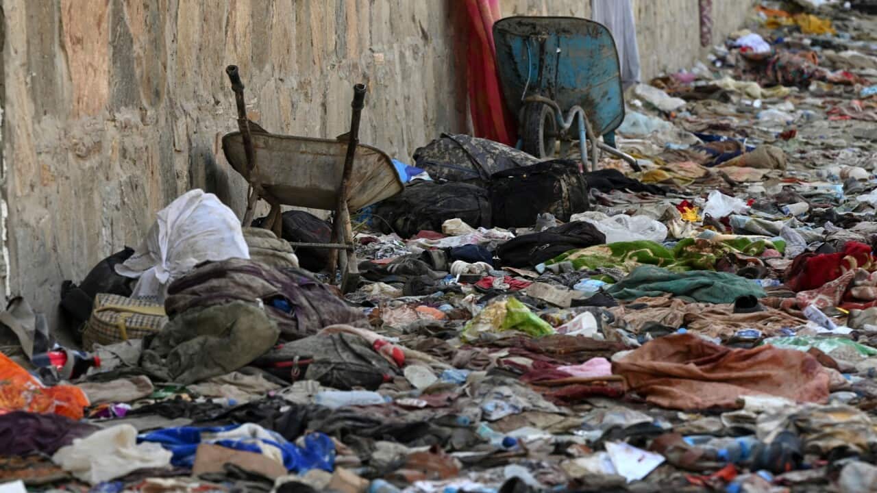 Backpacks and belongings of Afghan people waiting to be evacuated from Kabul airport