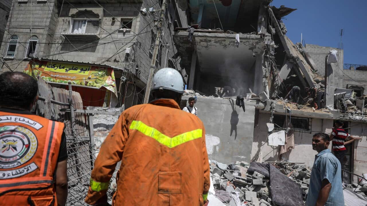 Palestinians search for survivors following Israeli airstrike on at al-Nuseirat refugee camp