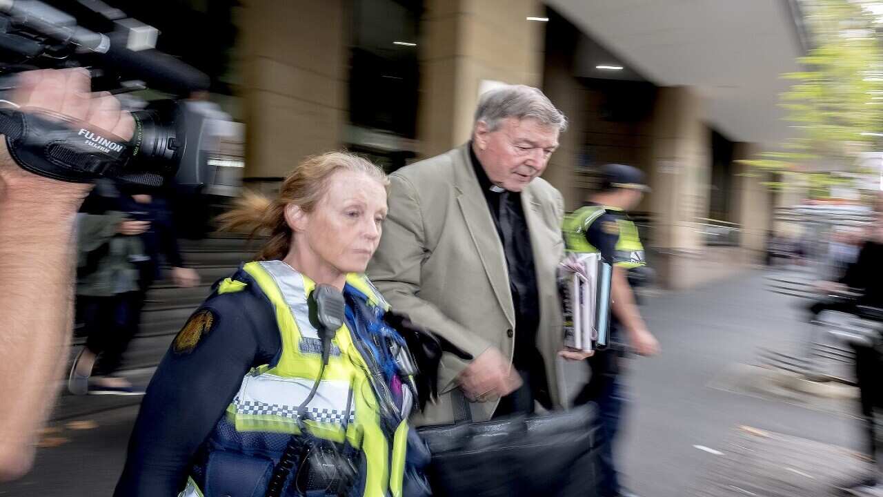 Cardinal George Pell leaves the Melbourne Magistrates Court on March 27.