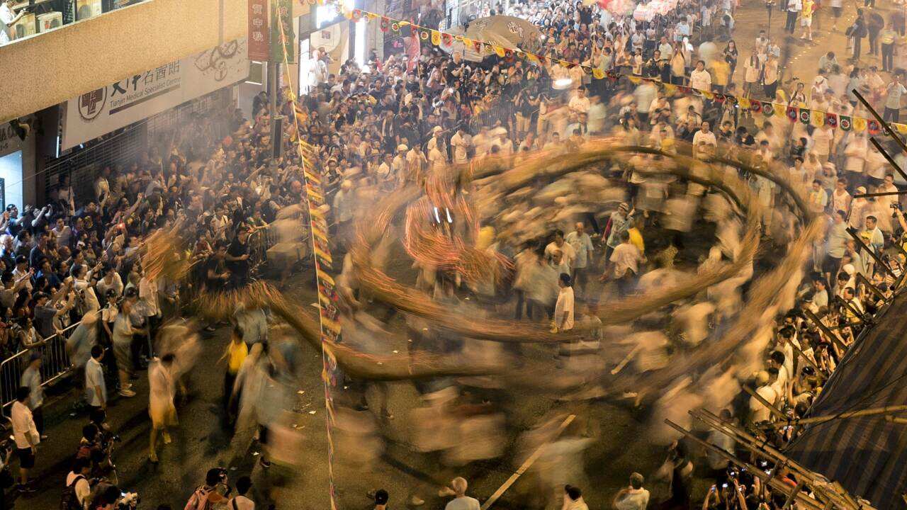 People perform the annual Tai Hang Fire Dragon Dance in Hong Kong on September 7, 2014.