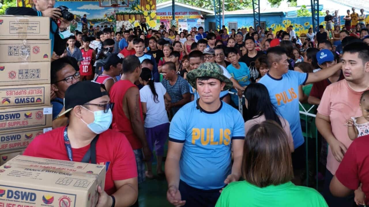 DSWD distribute relief packs to Filipinos in evecuation centres