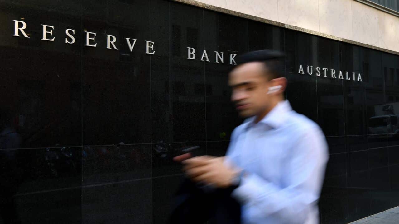 A pedestrian walks past the Reserve Bank of Australia (RBA) building in Sydney.