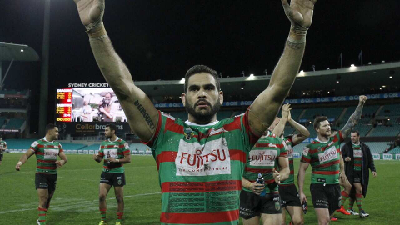 Rabbitohs' Greg Inglis waves to their fans.