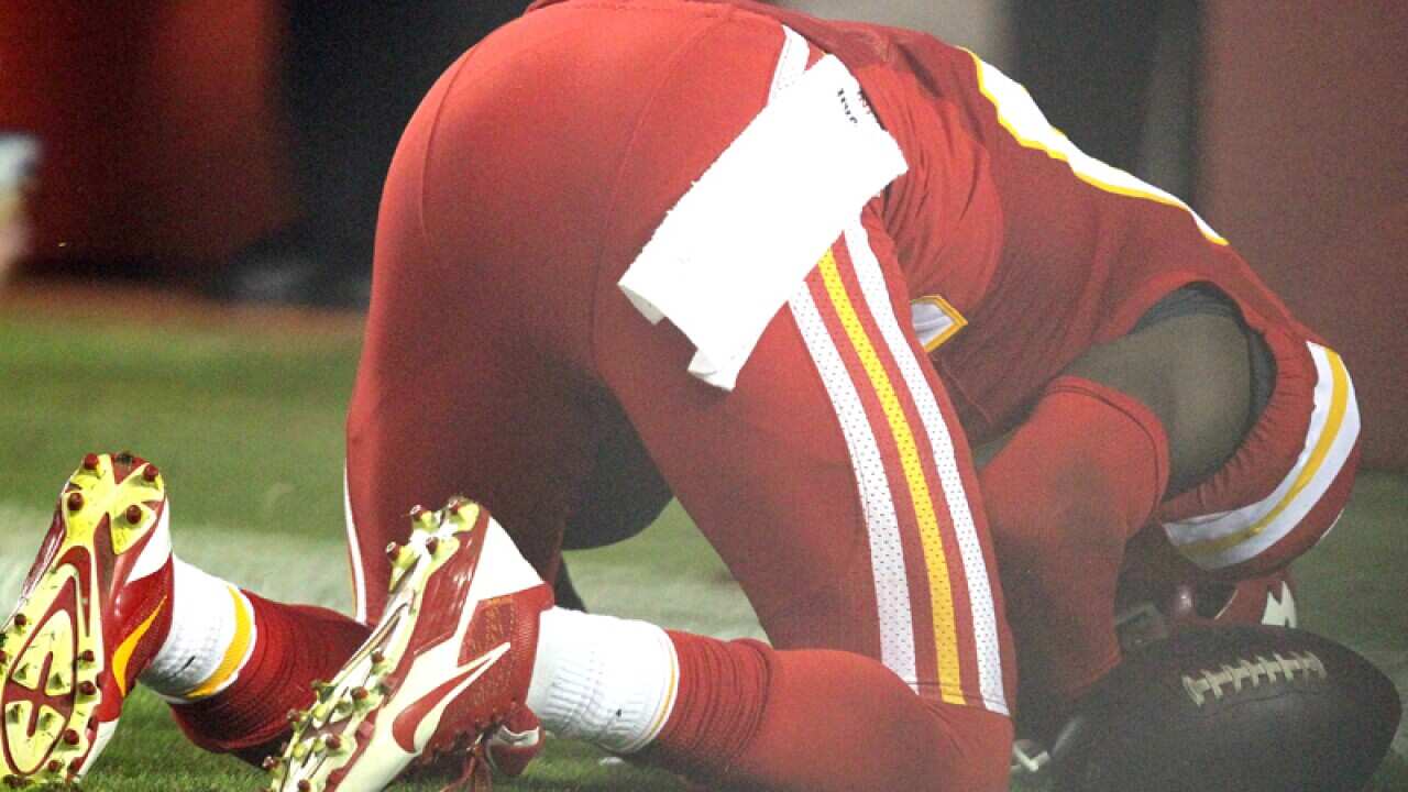 Kansas City Chiefs player Husain Abdullah prays scoring a touchdown