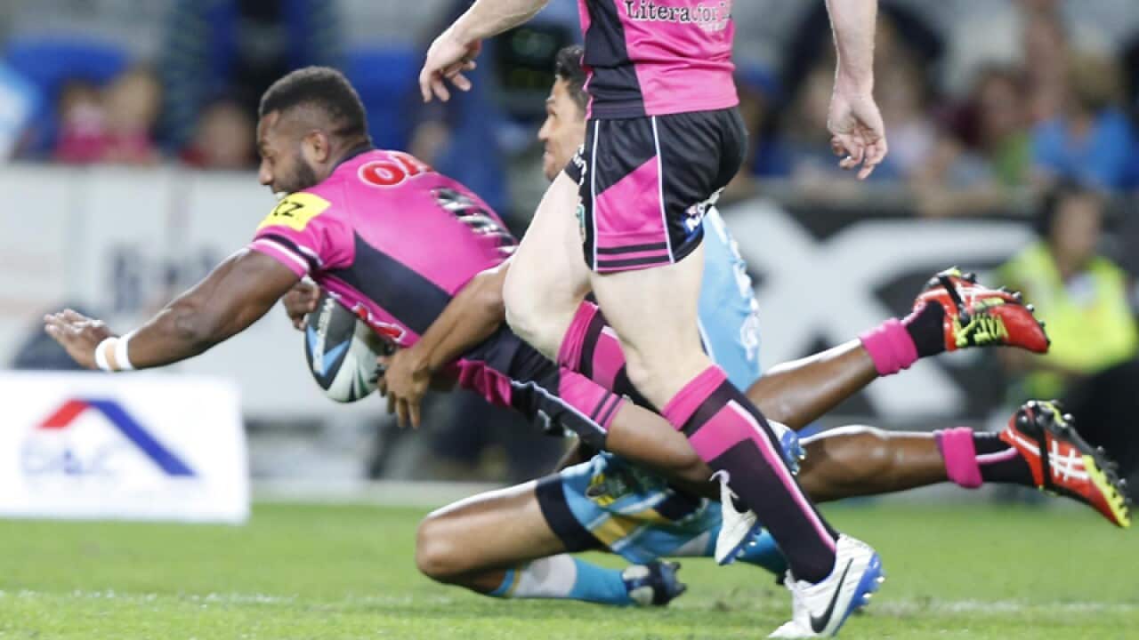 Penrith's James Segeyard scores against the Gold Coast Titans