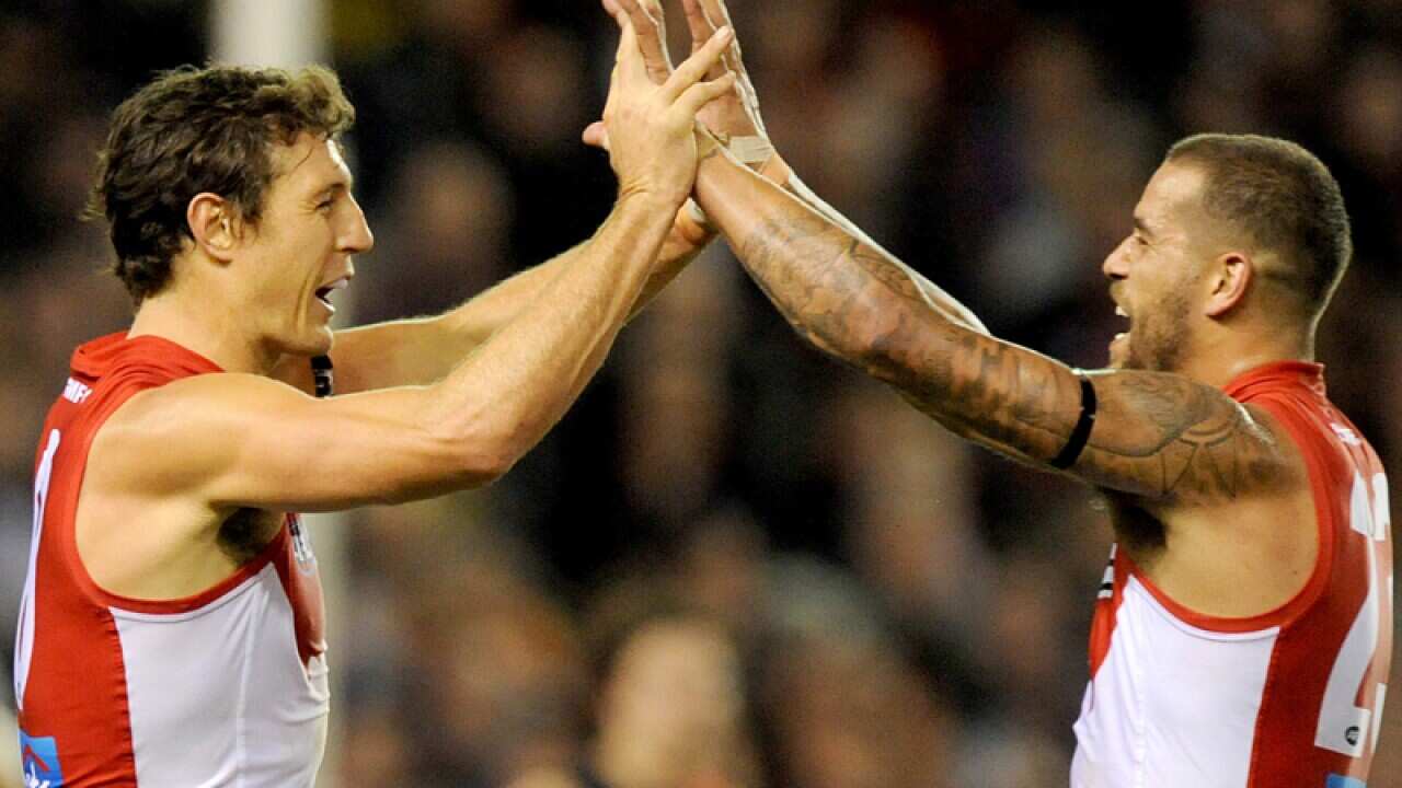 Kurt Tippett celebrates with Lance Franklin of Sydney