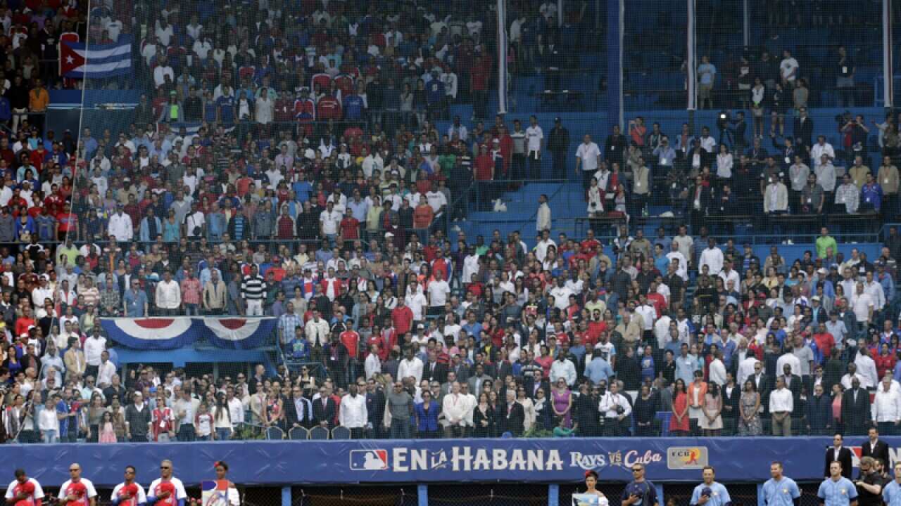 Members of the Cuban national and Tampa Bay Rays baseball teams