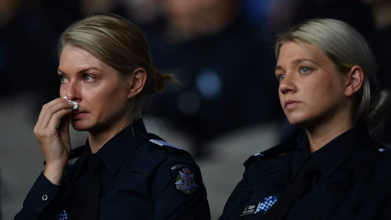 Victoria Police officers attend a memorial service for four police officers killed on duty on the Eastern Freeway.