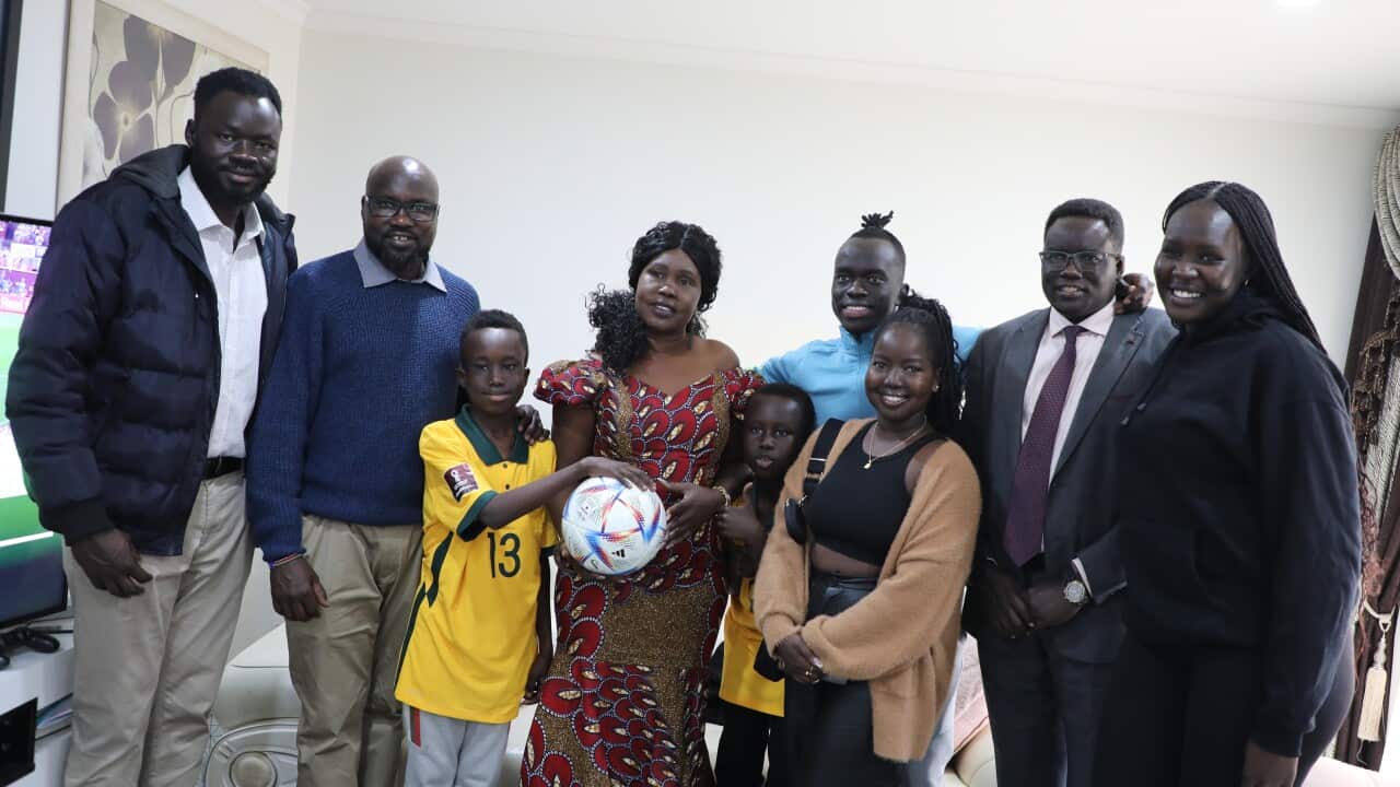 Awer Bul Mabil with his family and friends