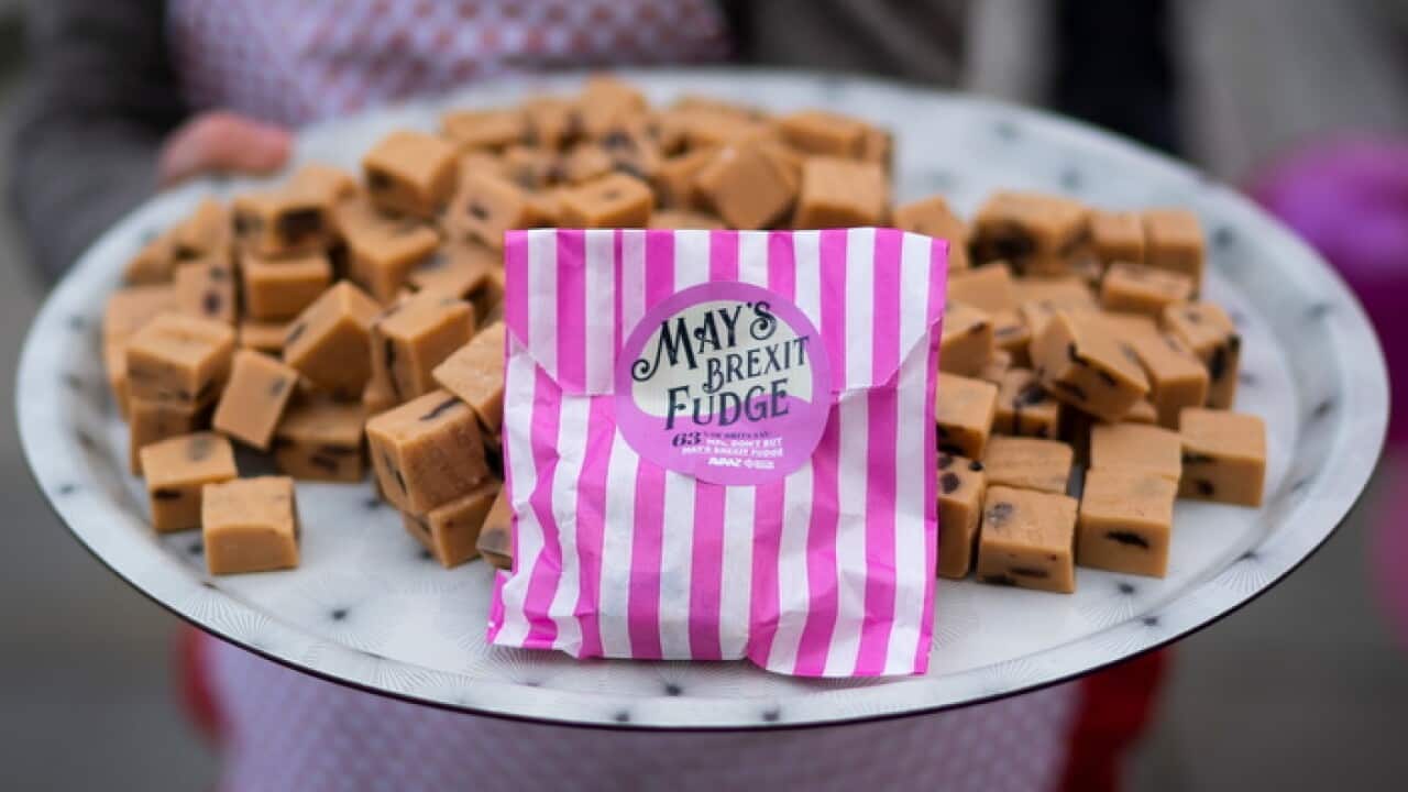 n anti-Brexit protester carrying sweets outside Houses of Parliament in Central London (AAP)