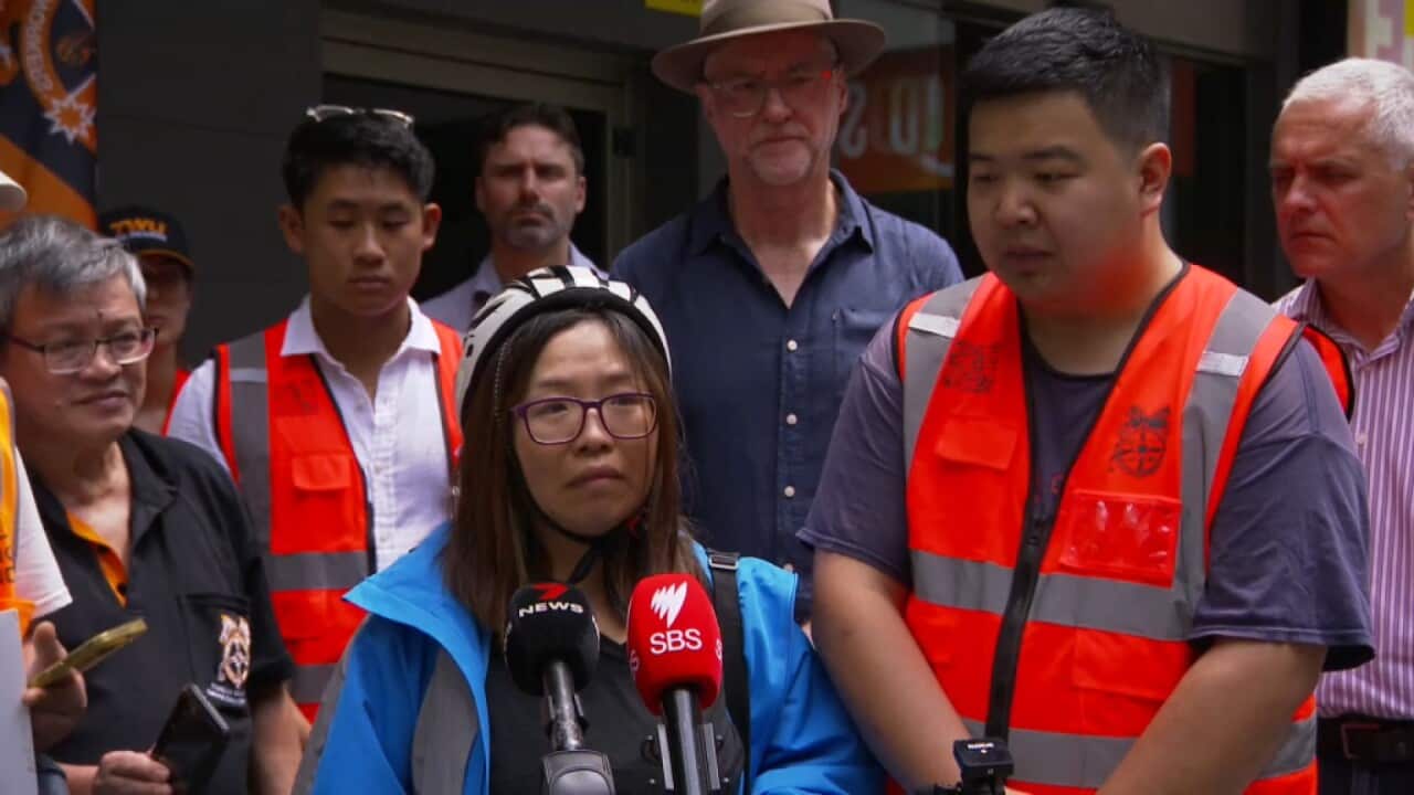 Hungry Panda food delivery service riders look distraught as they speak at a press conference in Sydney, Wednesday January 31