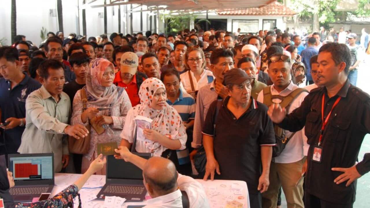 Indonesian migrant workers in Kuala Lumpur casting their votes in the recent election.
