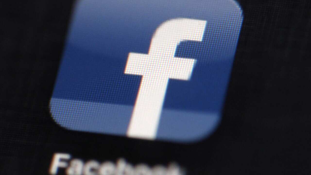 The Facebook logo displayed on an iPad