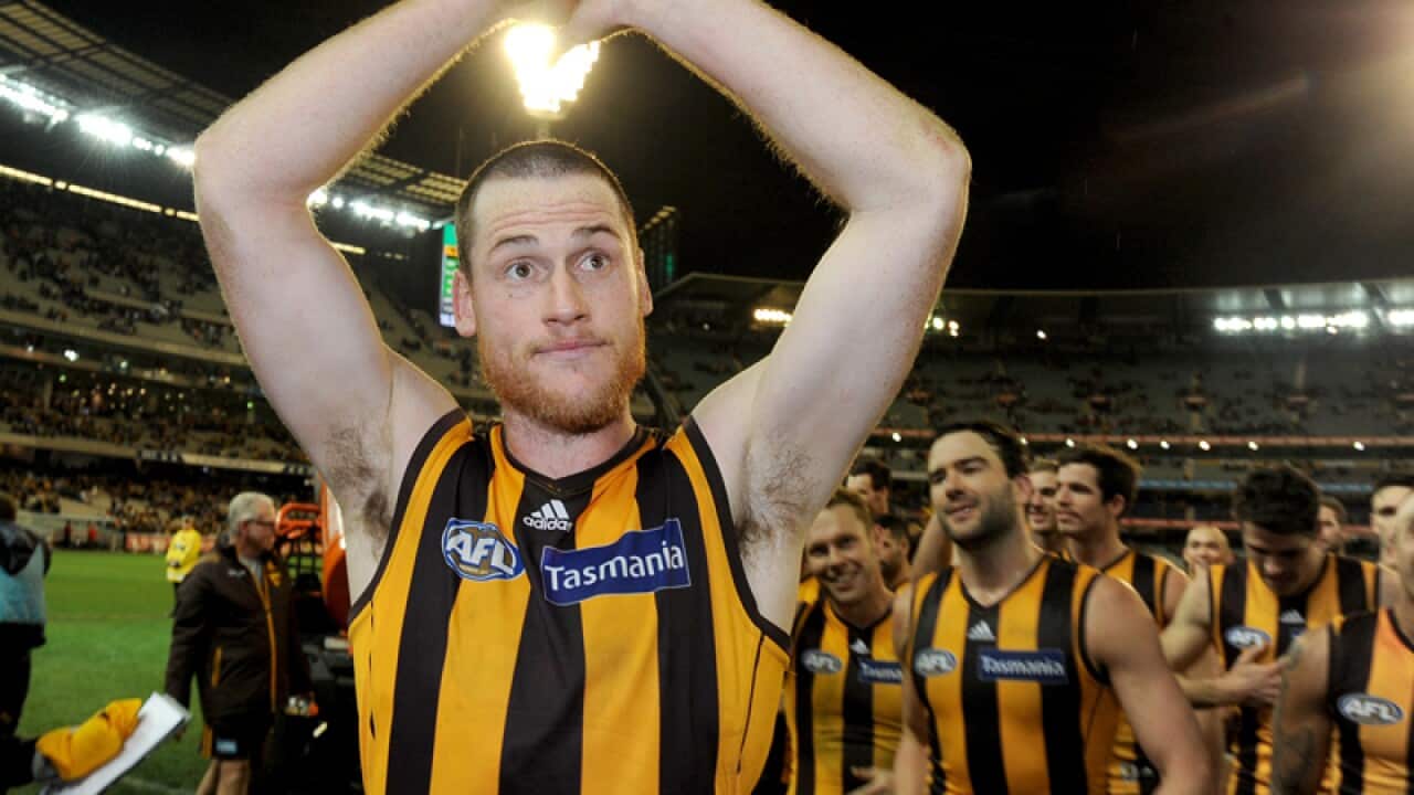 Jarryd Roughead of Hawthorn leads players off the ground