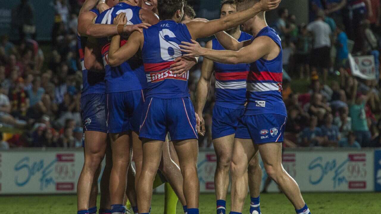 Western BullDogs players congratulate Micheal Talia