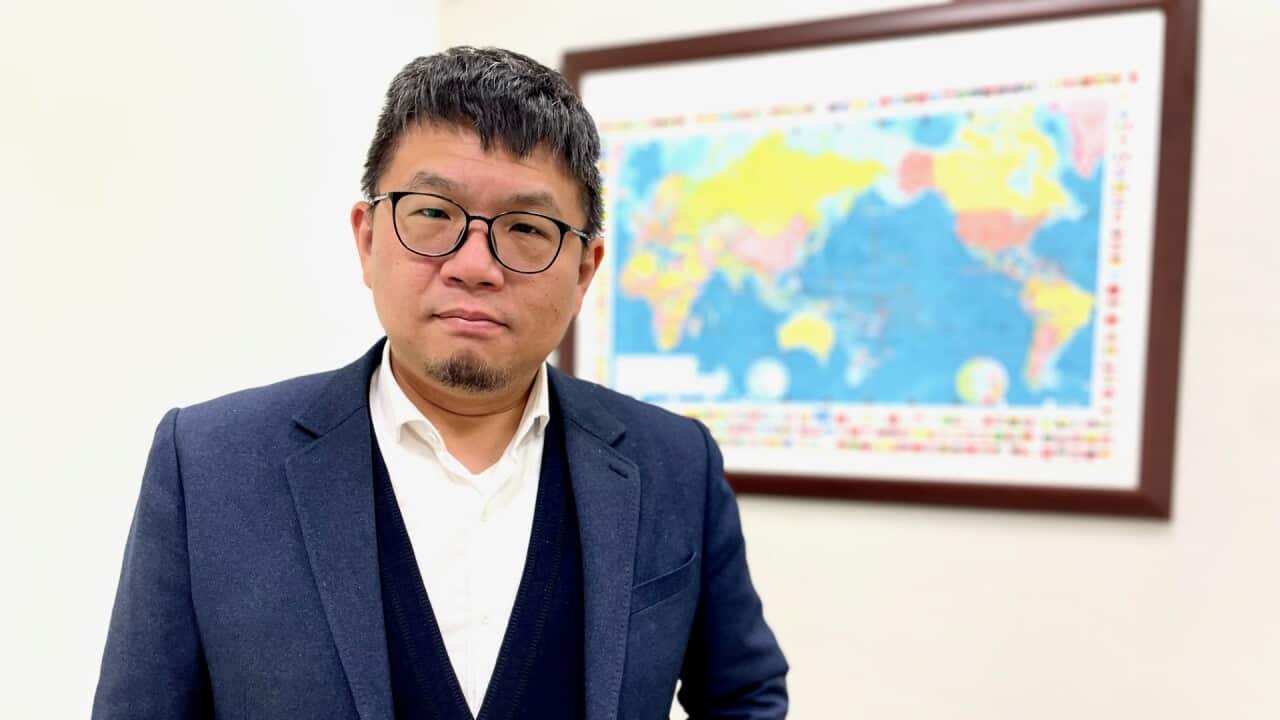 Defence analyst Dr Jyh-Shyang Sheu wearing a blue suit.