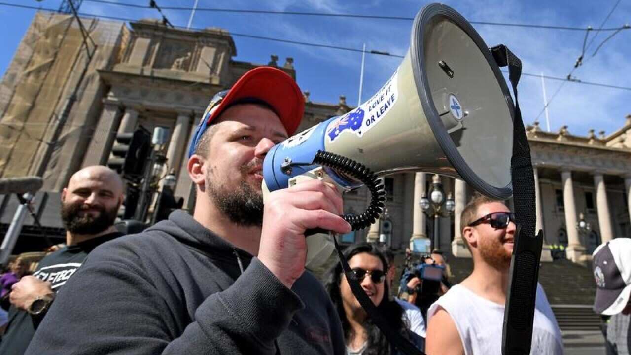Far-Right activist Neil Erikson speaks at a far-right political rally.
