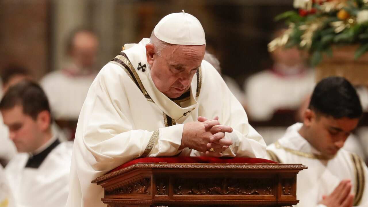 Pope Francis prays as he celebrates Christmas Eve Mass in St. Peter's Basilica at the Vatican, Tuesday, Dec. 24, 2019. (AP Photo/Alessandra Tarantino)