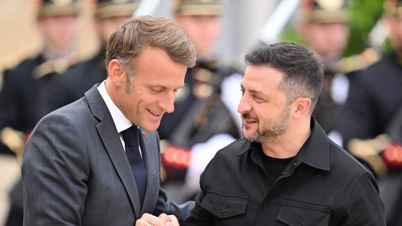 Volodymyr Zelenskyy at the Elysee Presidential Palace in Paris shaking hands