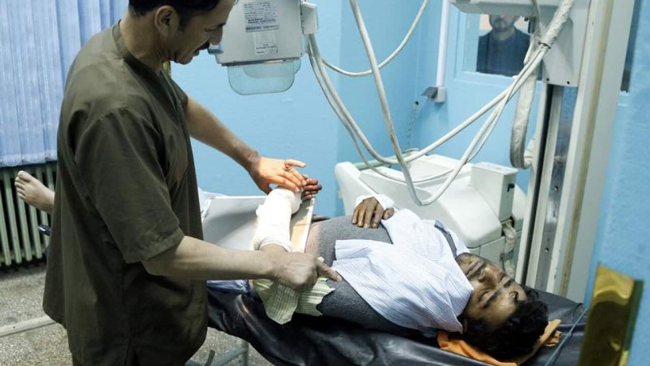 A man injured in the attack is treated at hospital