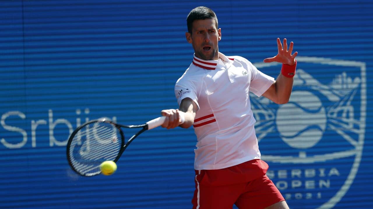 Novak Djokovic of Serbia returns a ball to Miomir Kecmanovic of Serbia during their tennis match of the Serbia Open tennis tournament in Belgrade, Serbia, Friday, April 23, 2021. (AP Photo/Darko Vojinovic)