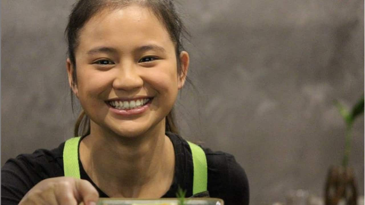 Moo Say Paw working at Holy Basil Thai restaurant.