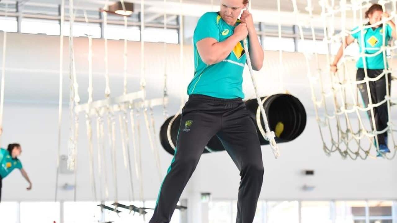 Sarah Aley attempts the obstacle course during training session.