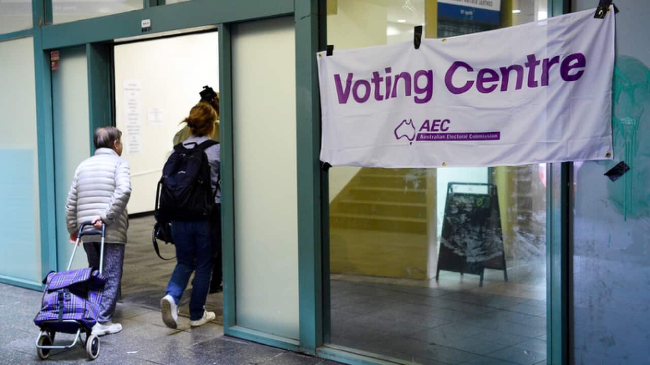 Voters are seen entering a pre-polling booth at Central Station, Sydney, Monday, April 29, 2019.