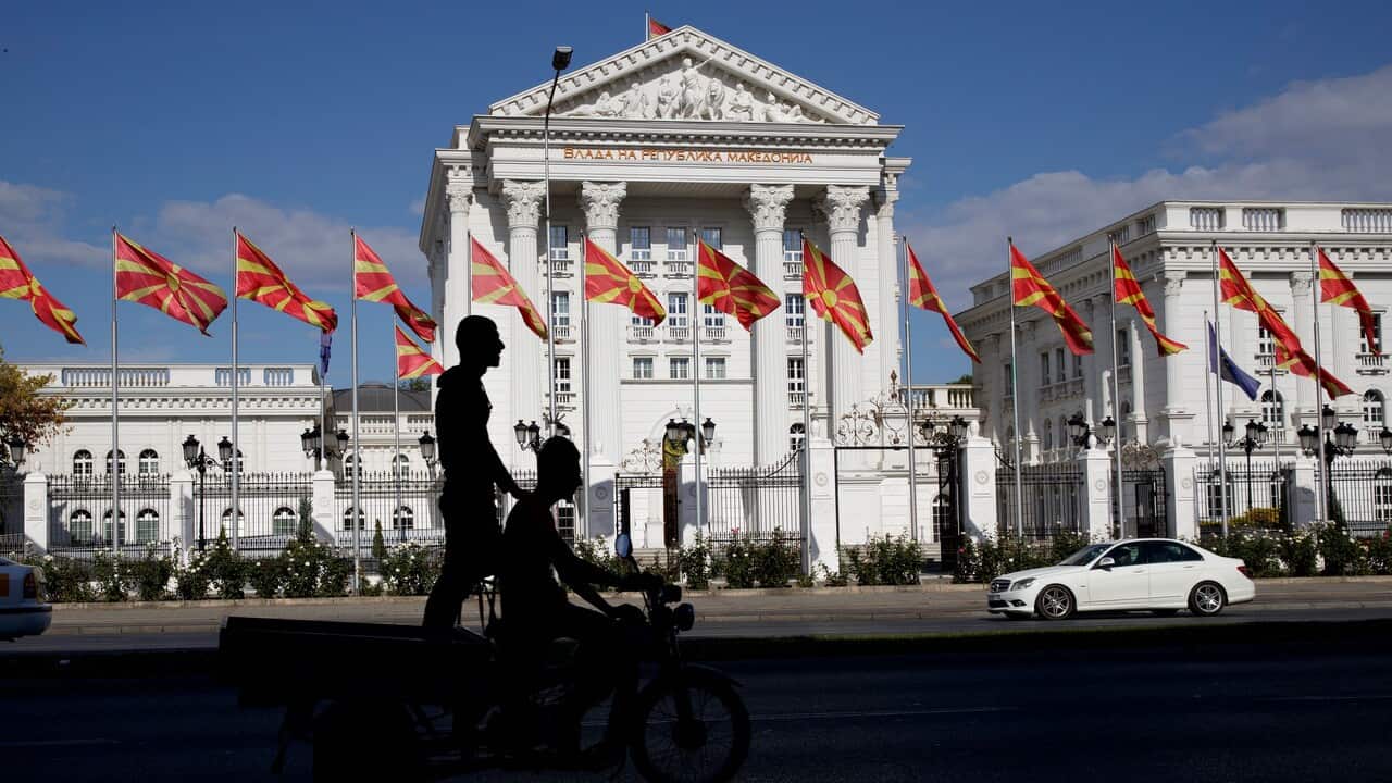 Macedonian national flags wave in front of the government building, ahead of the Macedonia name deal referendum.