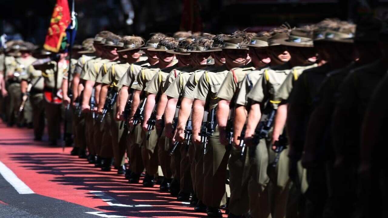 Defence forces veterans and service people at an ANZAC Day march.