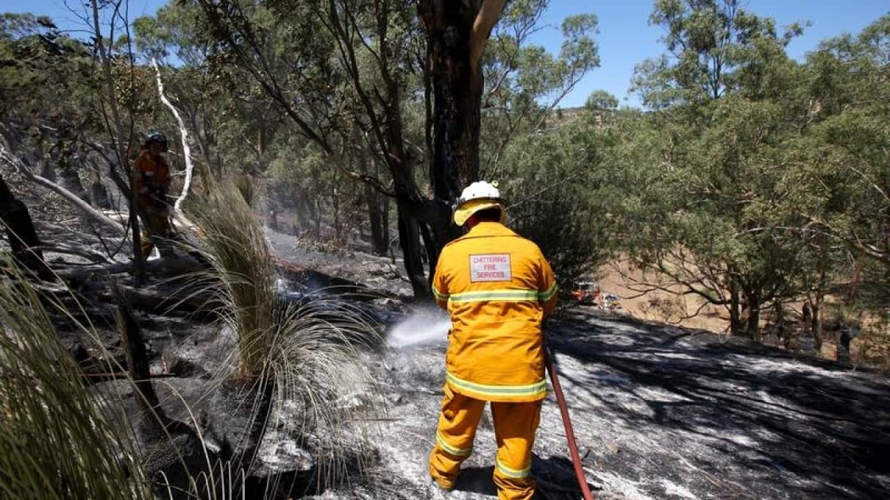 Firefighters dampening down hot spots