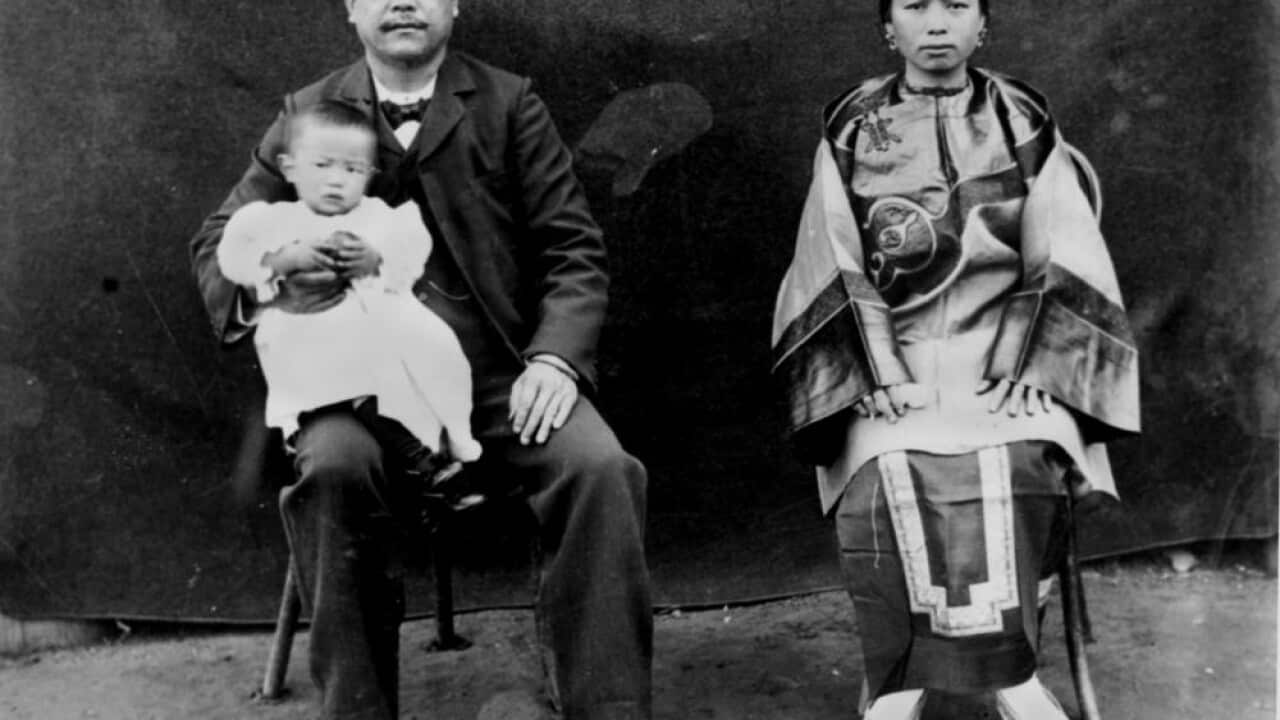 Family portrait of storekeeper Al Coy, his wife and baby at St. George, Queensland. They were part of the migrants from the Guangzhou province who arrived in north Queensland in the wake of the Palmer River gold rush of the 1870s.