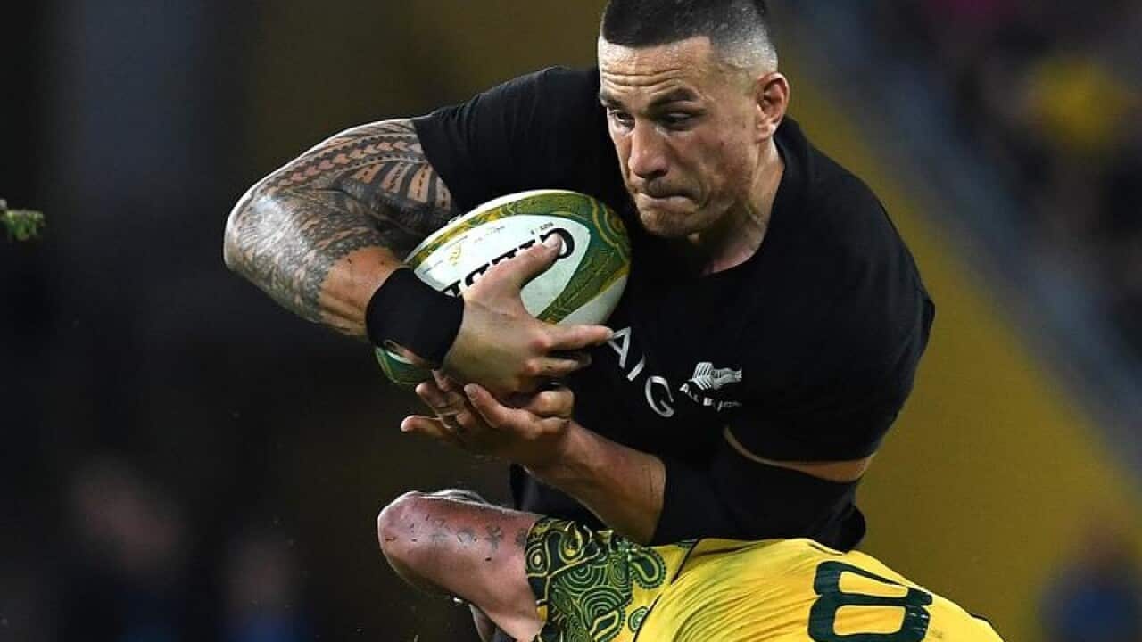 Sonny Bill Williams of the All Blacks is tackled