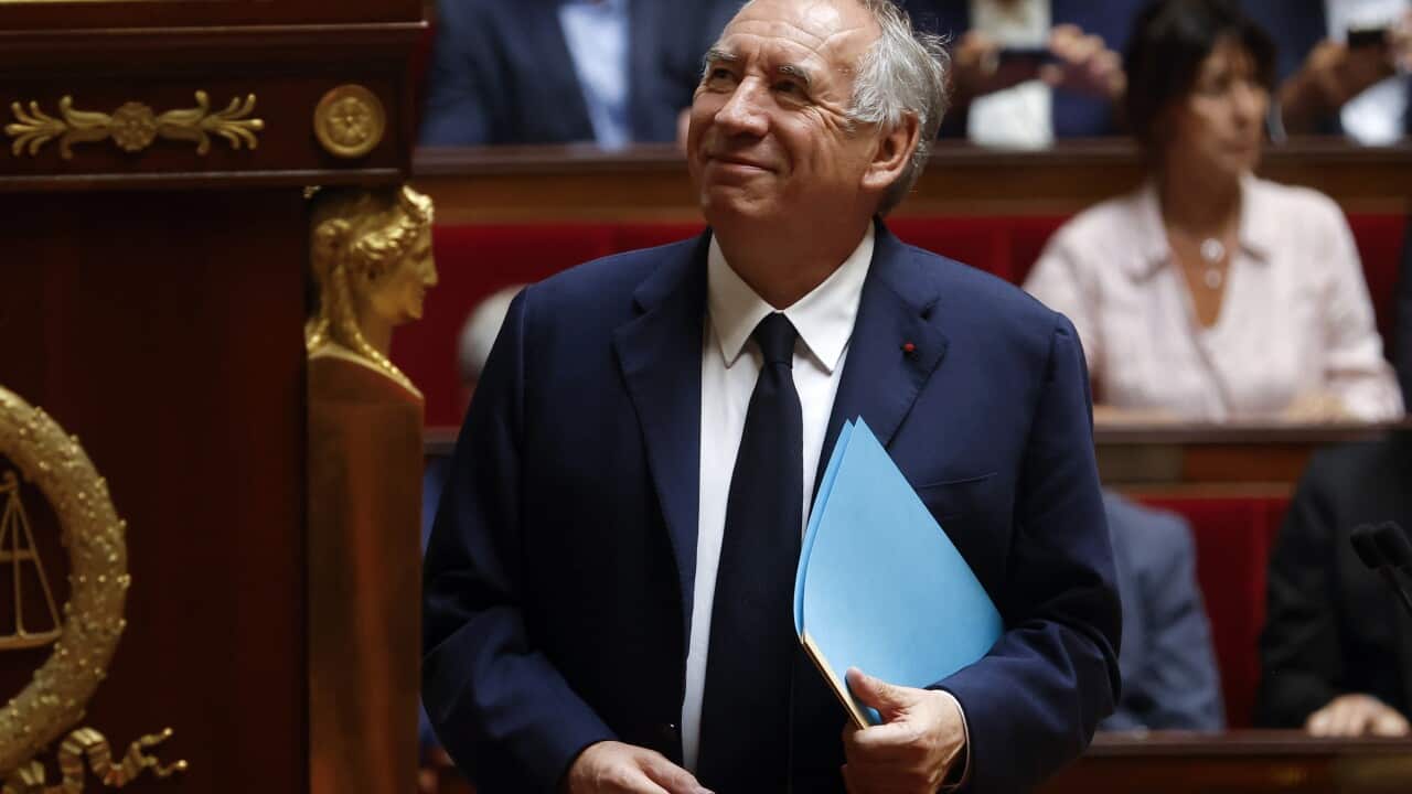 French Prime Minister Francois Bayrou standing in Parliament