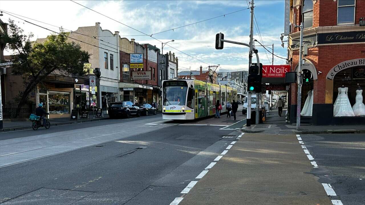 A tram stopping along Sydney Road in Melbourne.