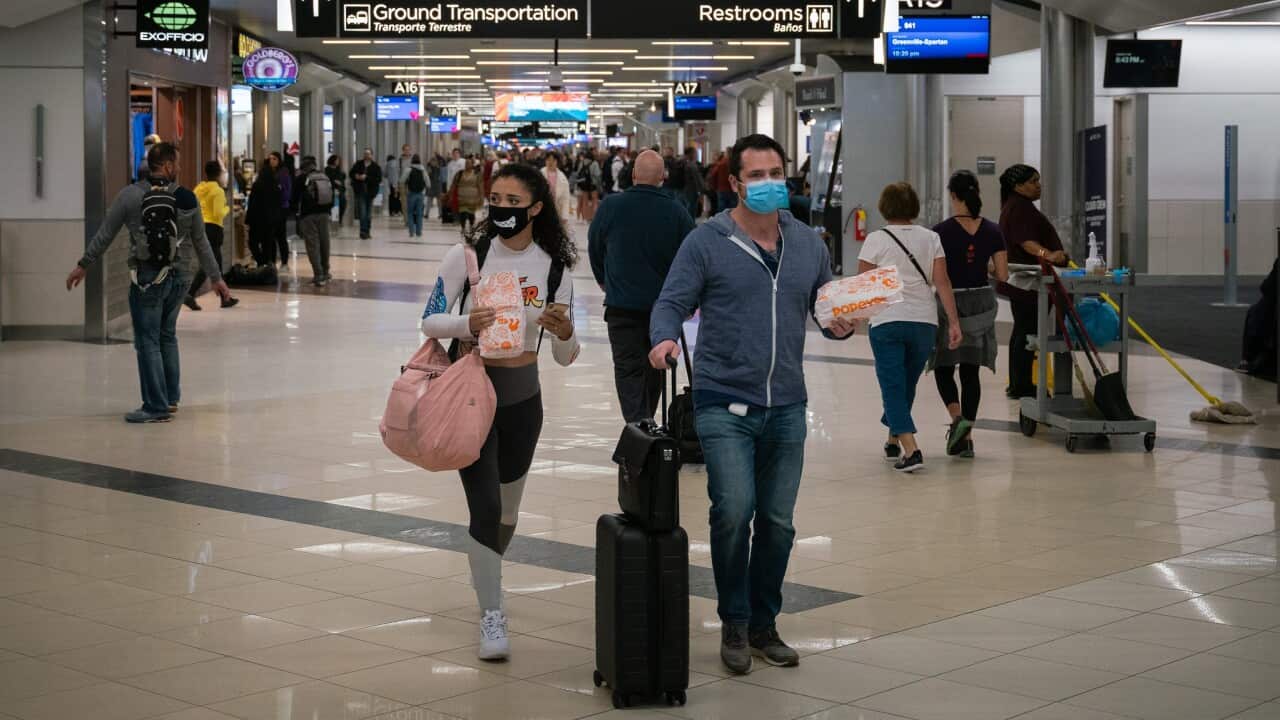 Flyers at Hartsfield-Jackson Atlanta International Airport wearing facemasks on March 6th, 2020 as the COVID-19 coronavirus spreads throughout the United States.