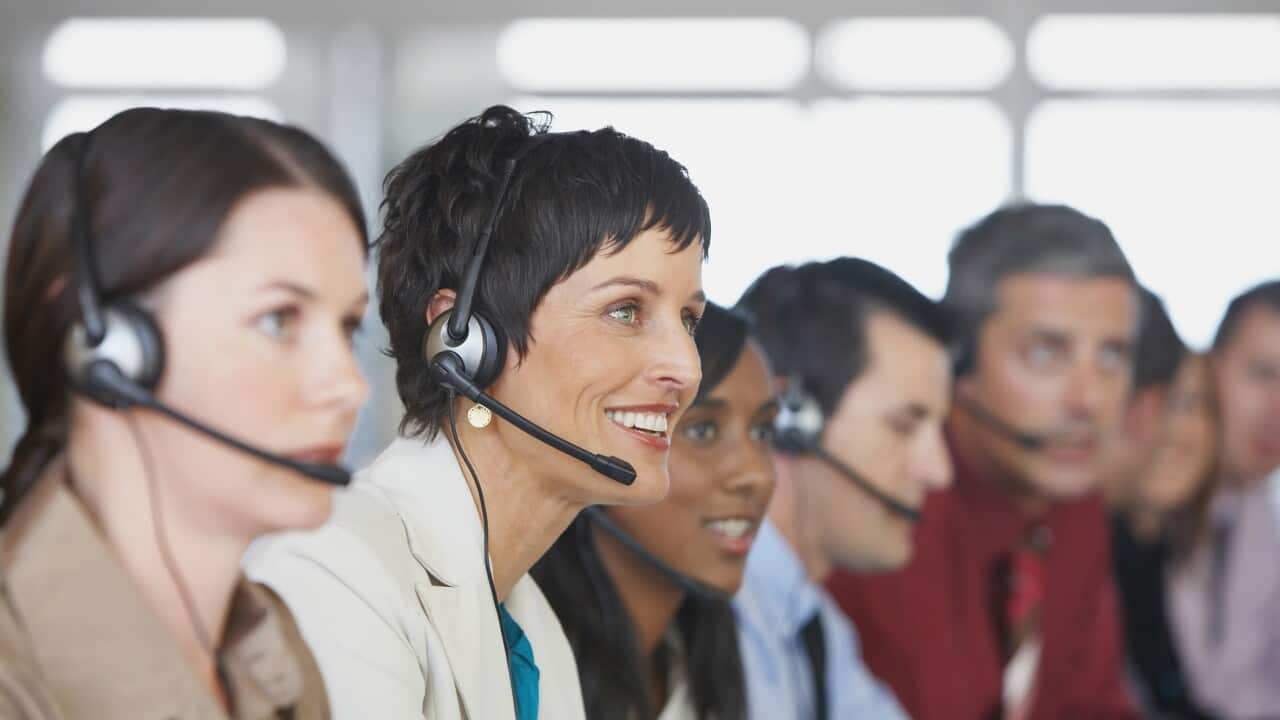 Businesspeople in meeting with translation