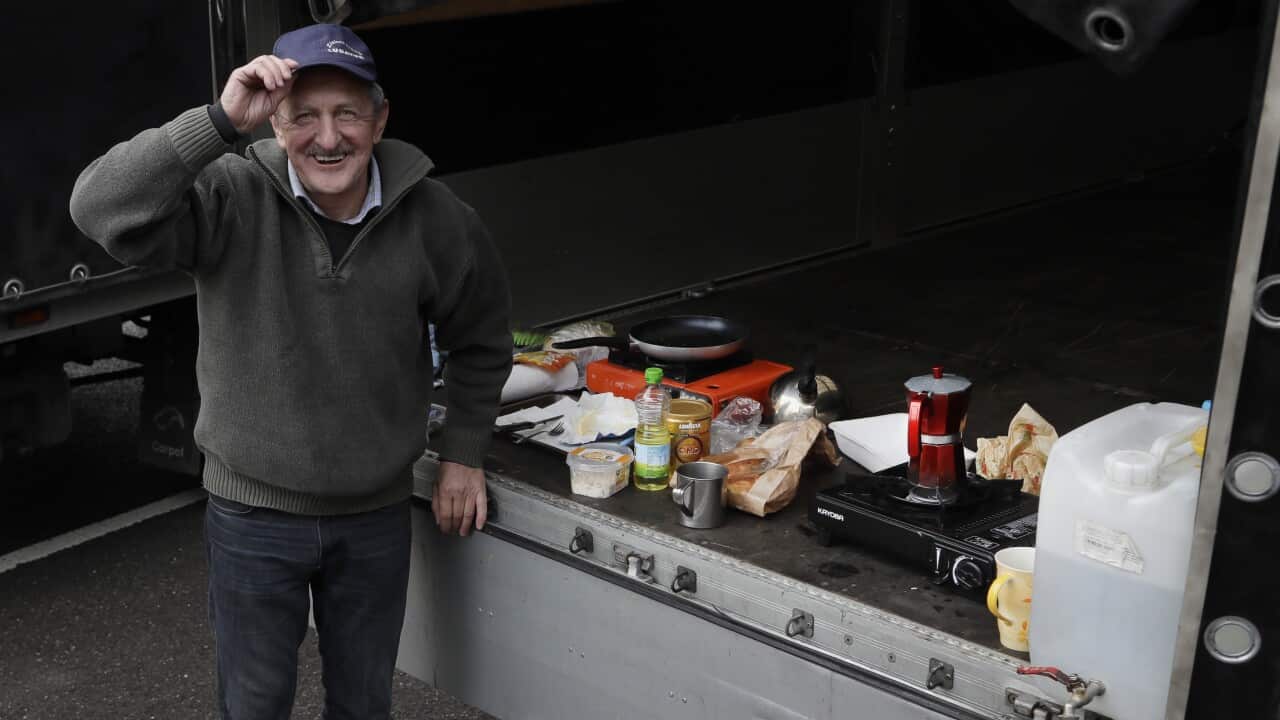 'Janke' from Poland poses with his cooking apparatus set up in the back of his van, whilst the Port of Dover remains closed, in Dover, southern England
