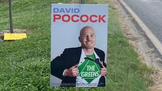 Advance Australia sign depicting ACT independent Senate candidate David Pocock as a "Greens superman"