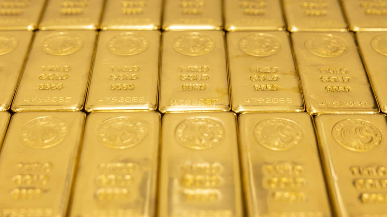 Rows of gold bullions.