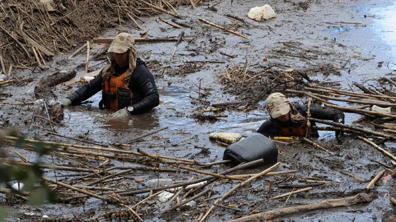 Police divers search amongst debris in Grantham