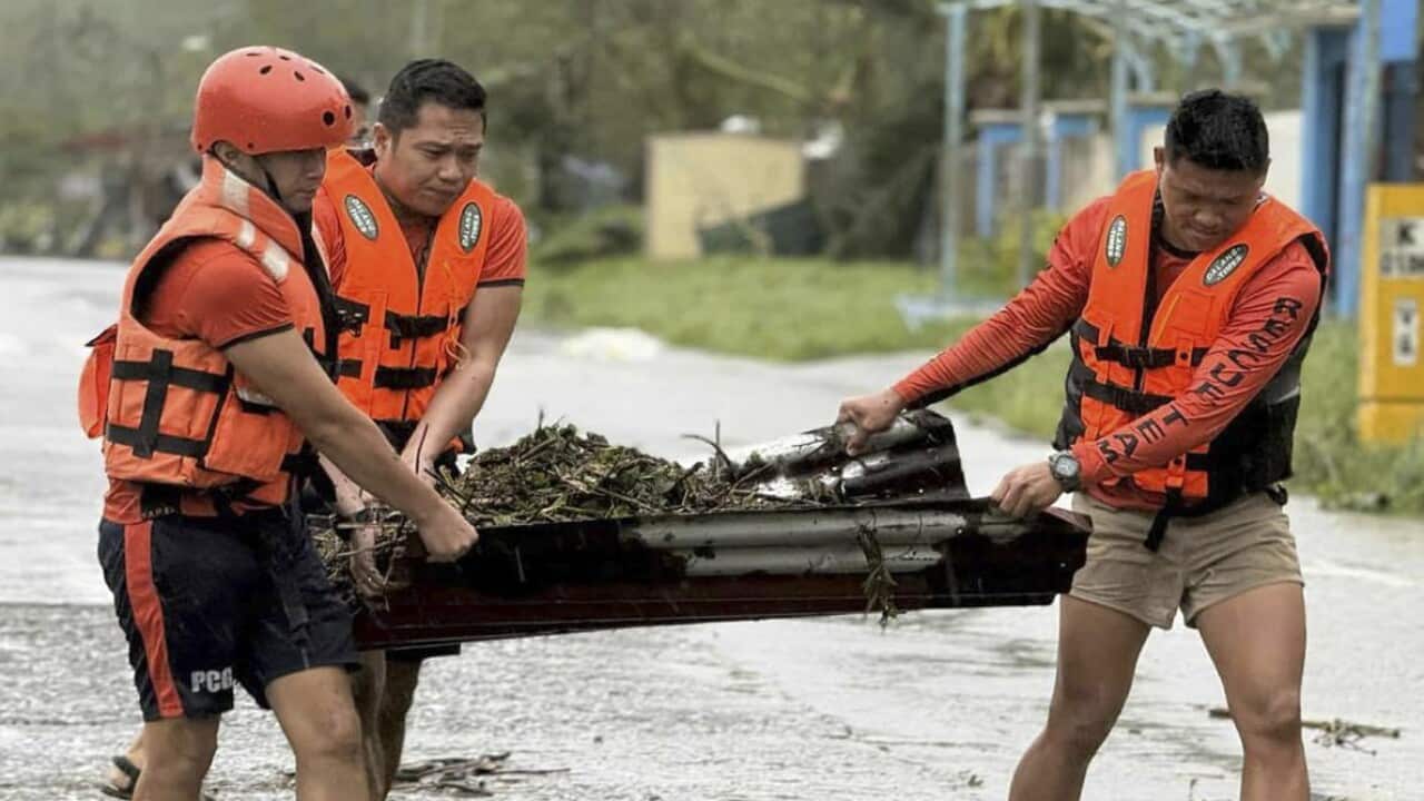 Philippine Coast Guard conducts road-clearing operations following Typhoon Fung-Wong
