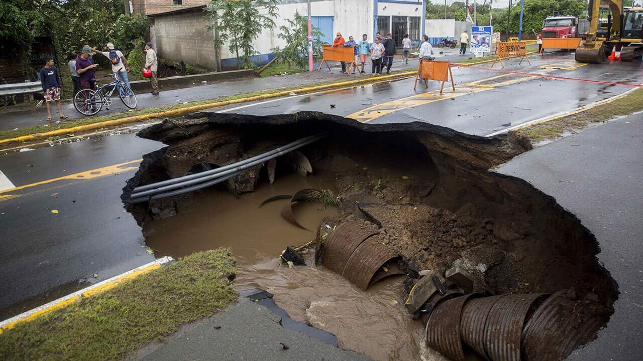  A view of a sinkhole on the street after the passage of tropical storm Nate in San Juan del Sur's bay in Rivas.
