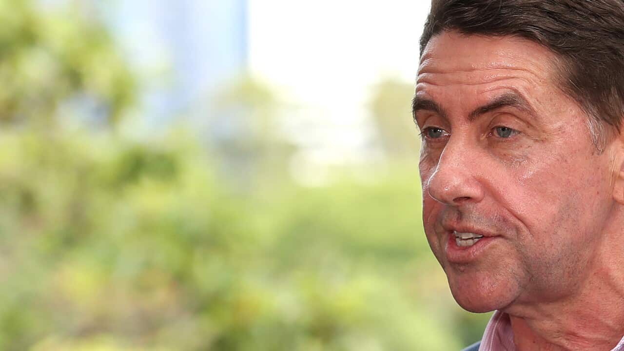 Queensland Treasurer Cameron Dick speaks at a press conference in Brisbane, Sunday, December 12, 2021. Queensland will prepare to open its borders to COVID hotspots from 1am tomorrow. (AAP Image/Jono Searle) NO ARCHIVING