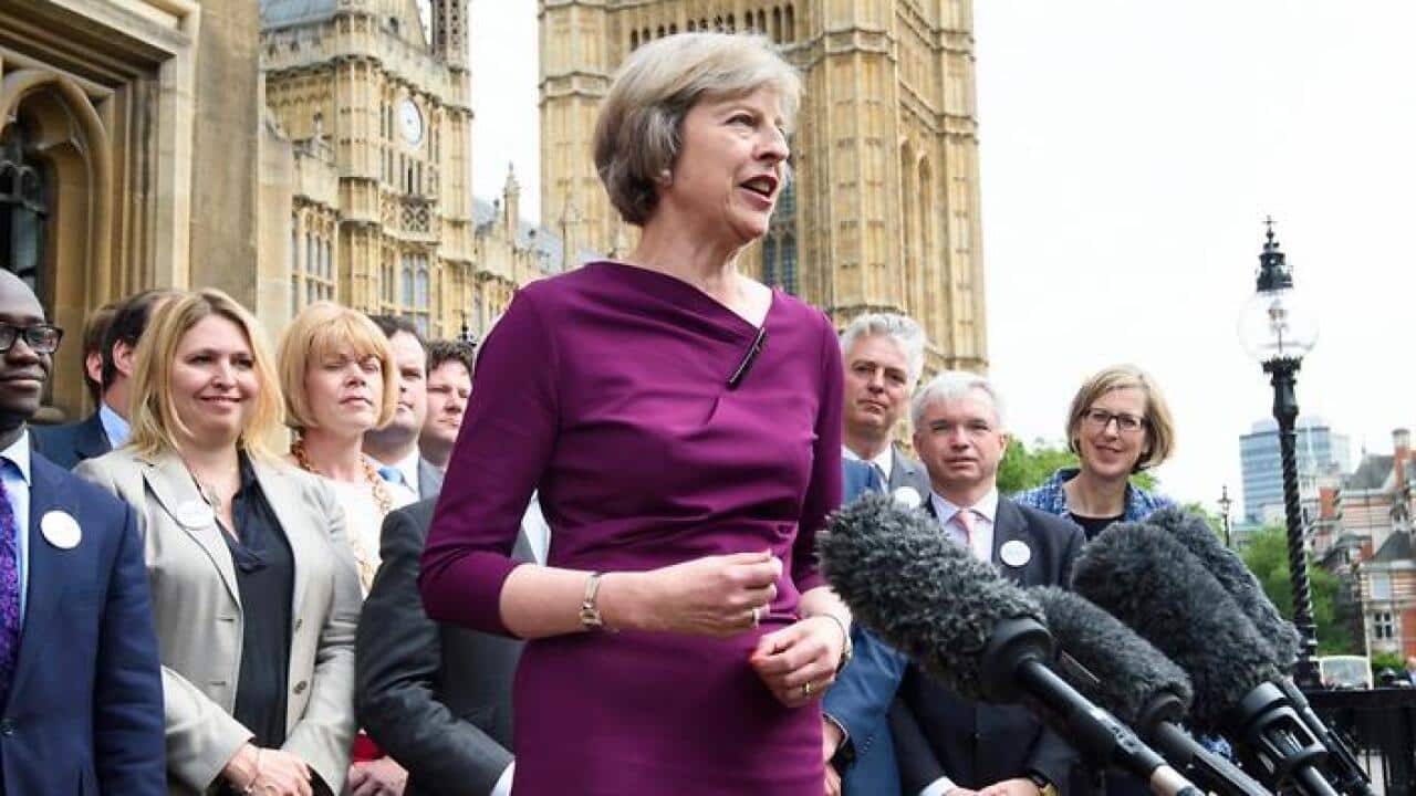 Home Secretary Theresa May makes a statement outside the Palace of Westminster, in London, after she won 199 votes from MPs. (AAP)