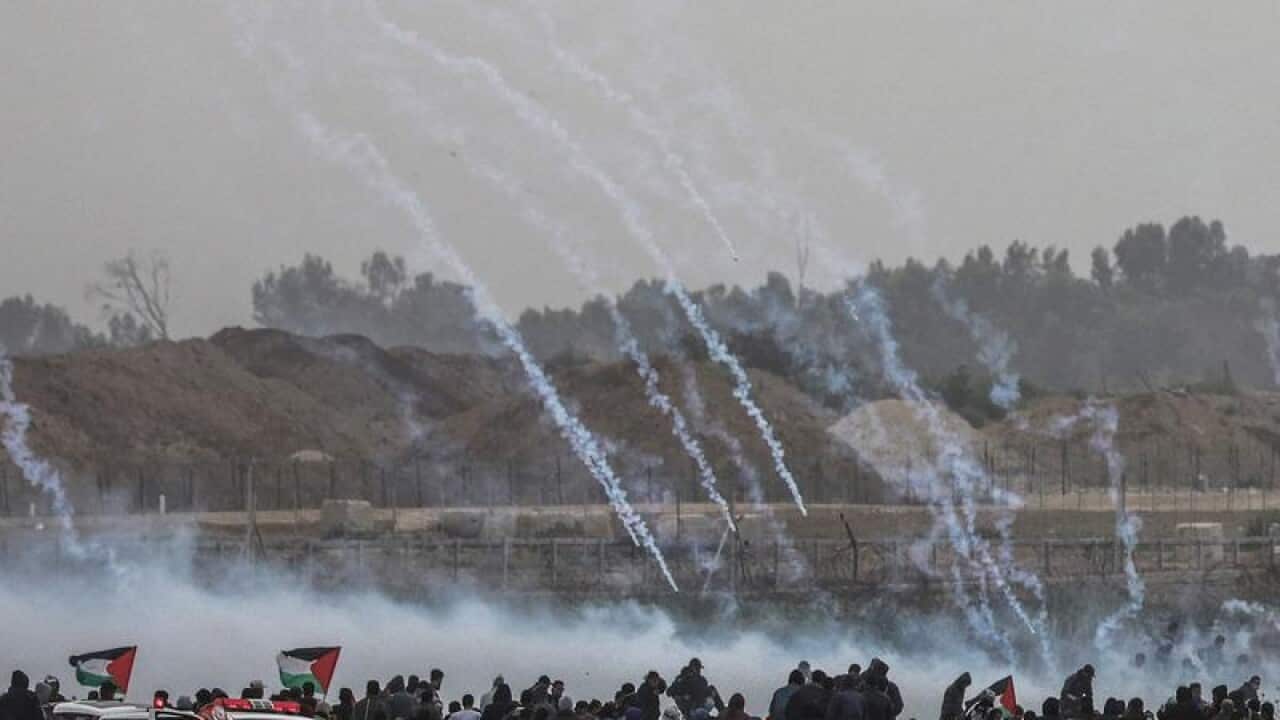 Tear gas is fired at Palestinian protesters